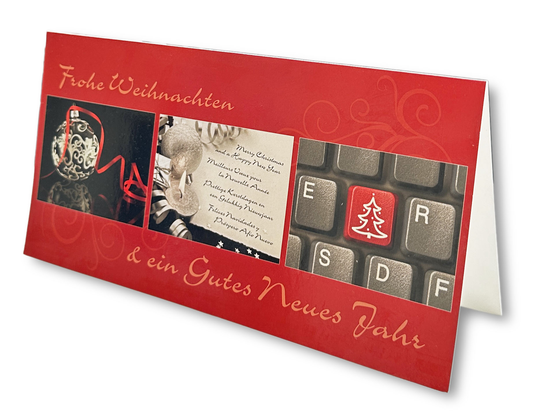 Geschäftliche Weihnachtskarte mit Kugel, Kerze und Computer-Tastatur sowie Weihnachts- und Neujahrsgruß.