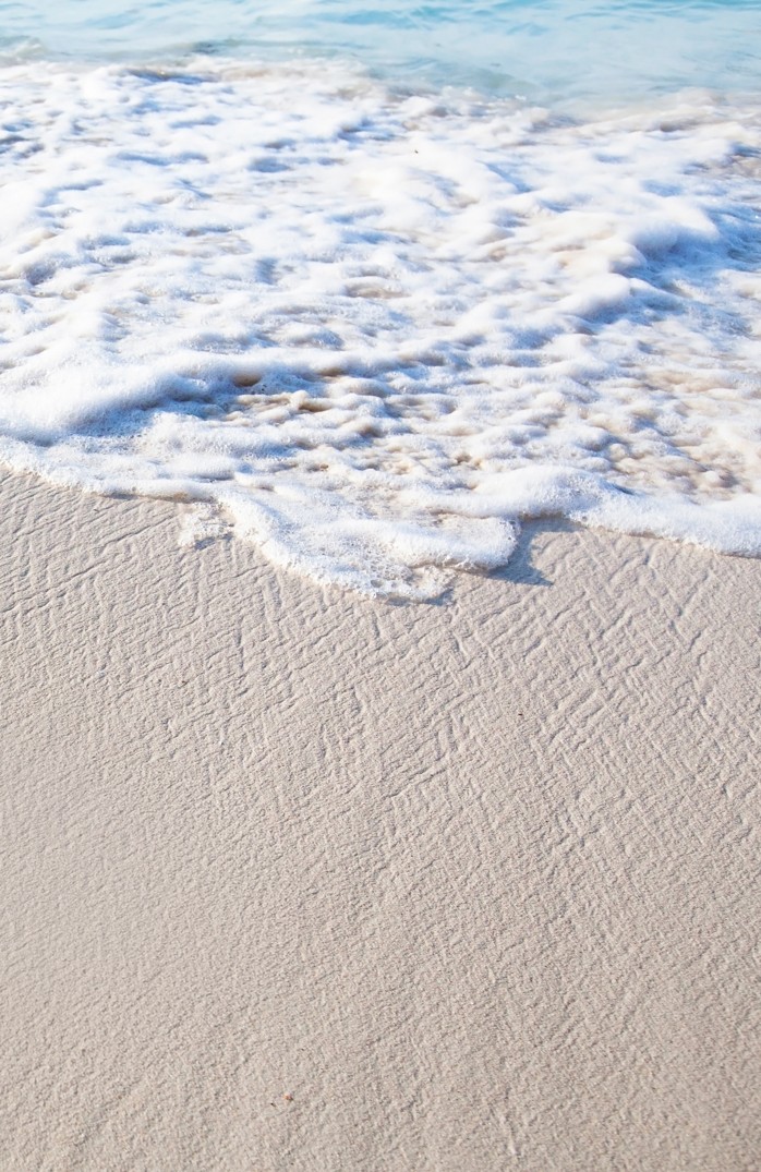 Sterbebild "Meeresrauschen" mit auslaufender Meeresgischt und Sandstrand