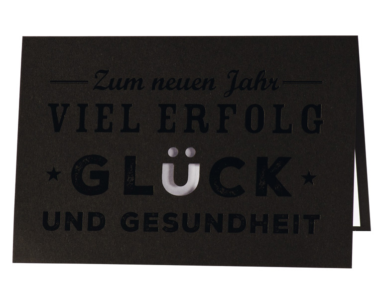 Neujahrskarte schwarz mit gestanztem Ü und weißem Einleger