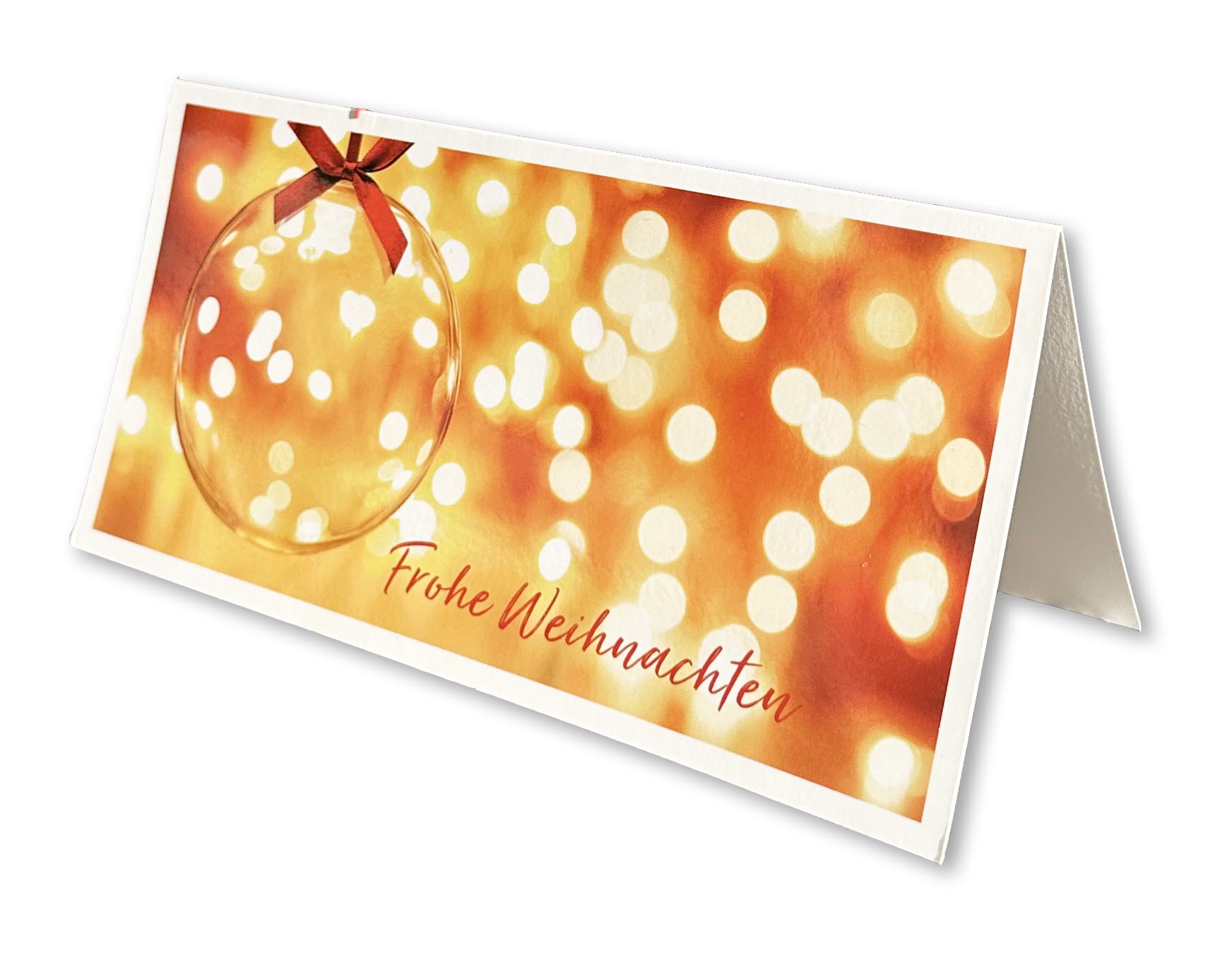 Strahlende Weihnachtskarte im DIN lang Format mit "Frohe Weihnachten", einer Christbaumkugel aus Glas und einem Lichtermeer im Hintergrund.