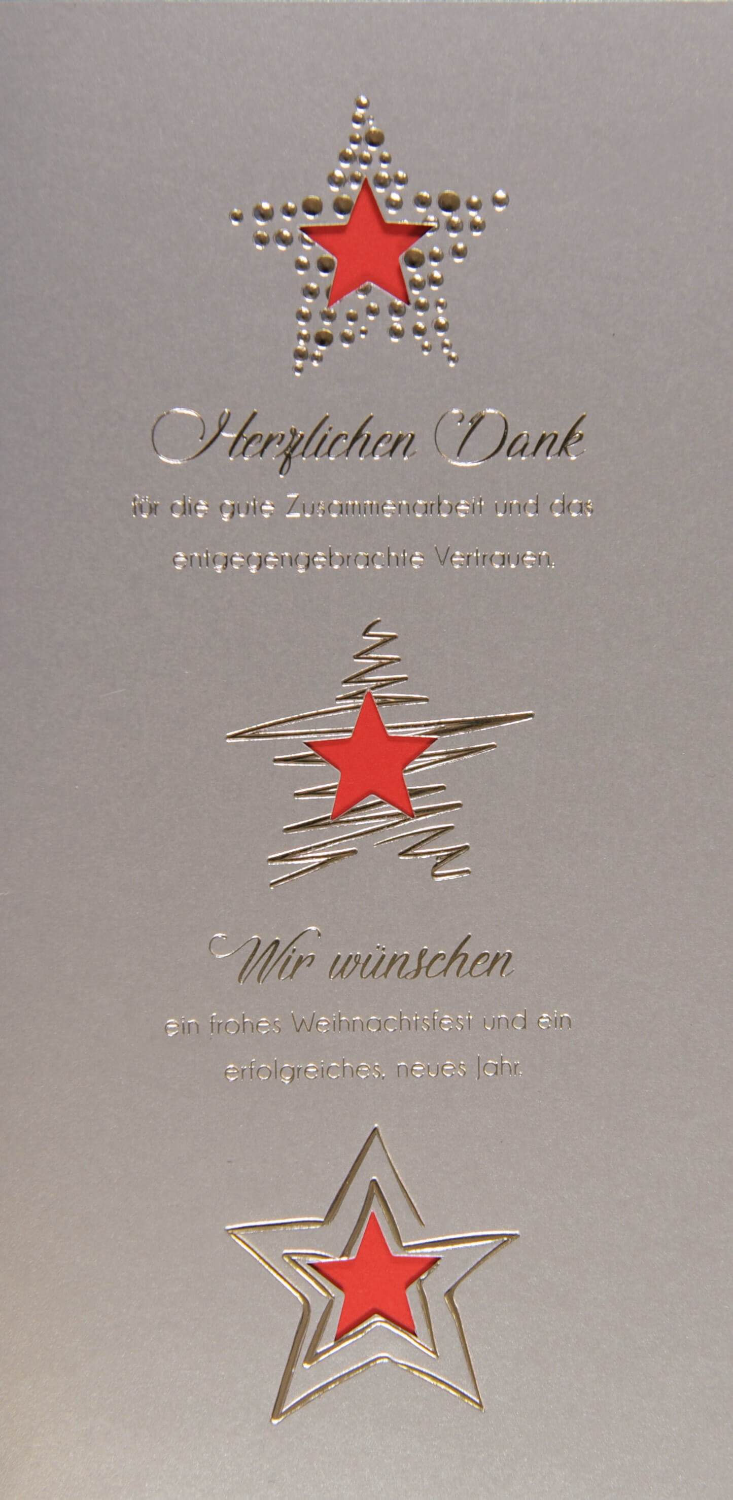 Moderne Firmenweihnachtskarte in silber mit Sternstanzung und silberner Folienprägung