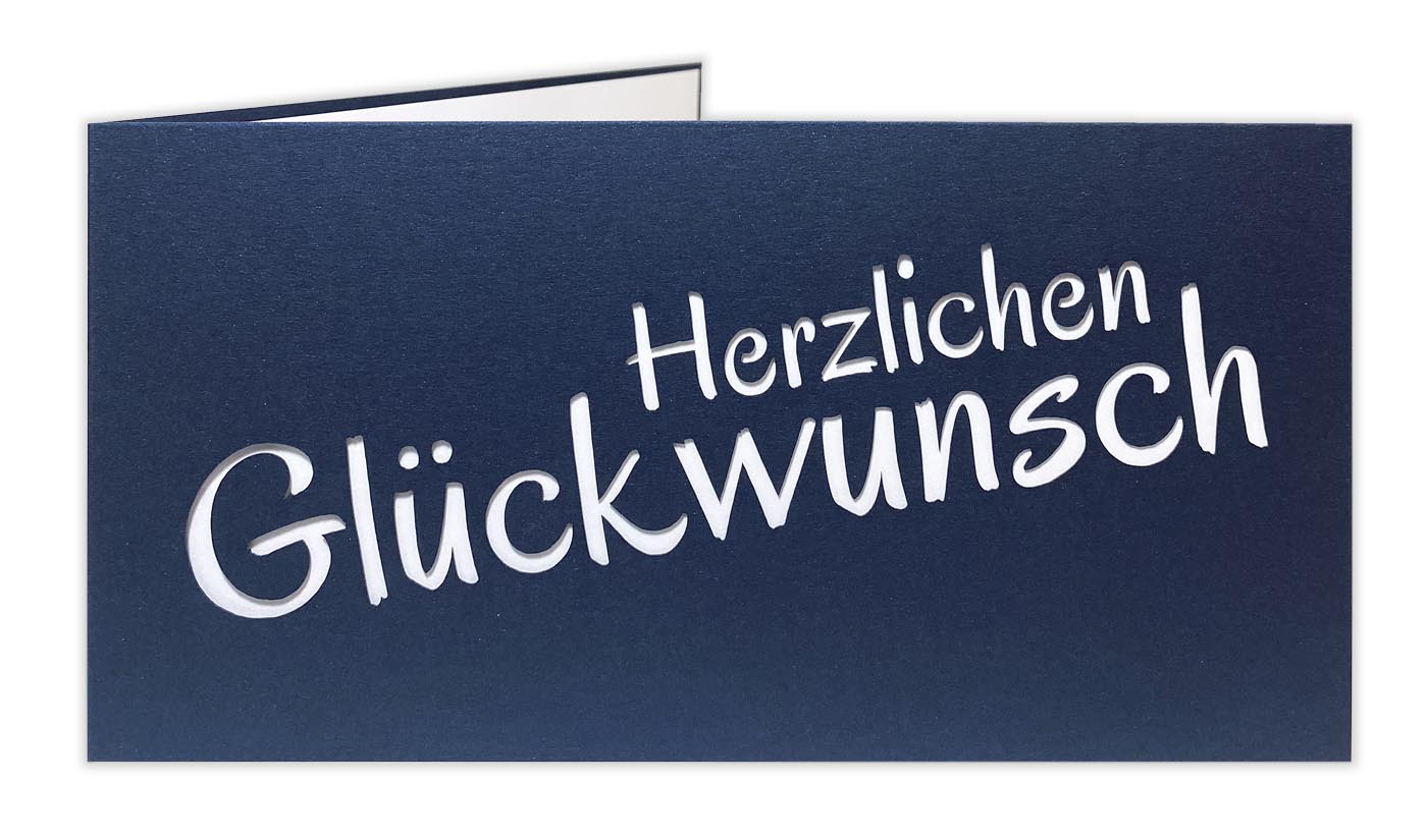 Dunkelblaue Glückwunschkarte mit Ausstanzung "Herzlichen Glückwunsch" und weißem Einlegeblatt