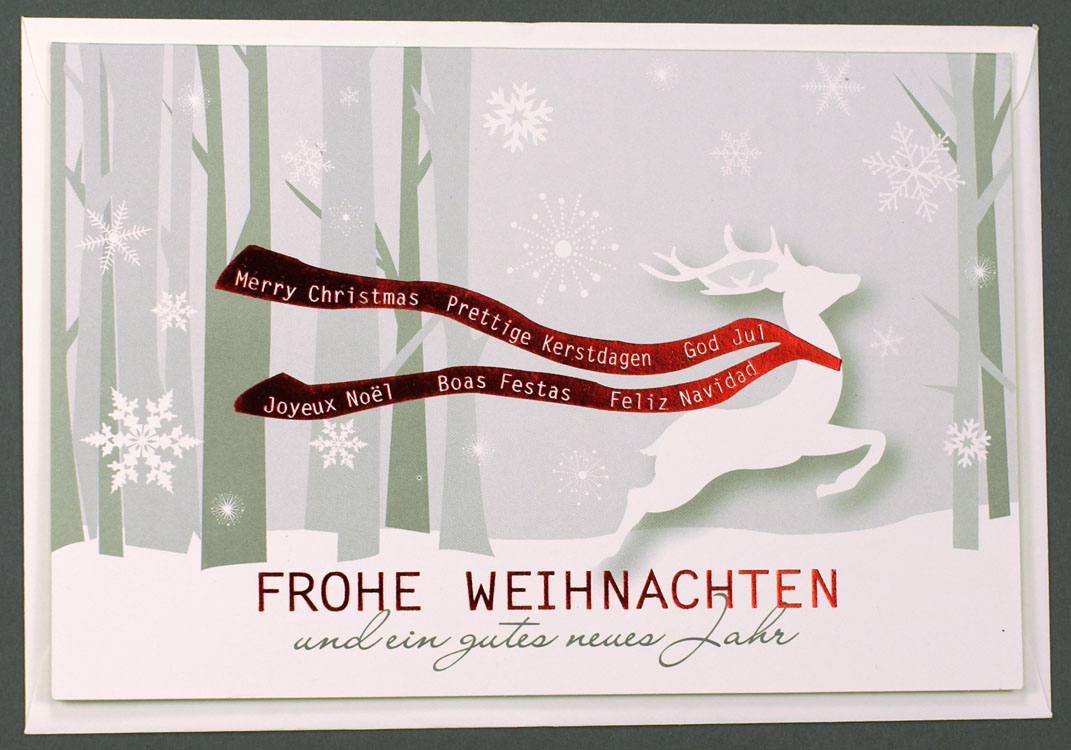 Weihnachtskarte mit Rentier im Wald mit mehrsprachigen Wünschen