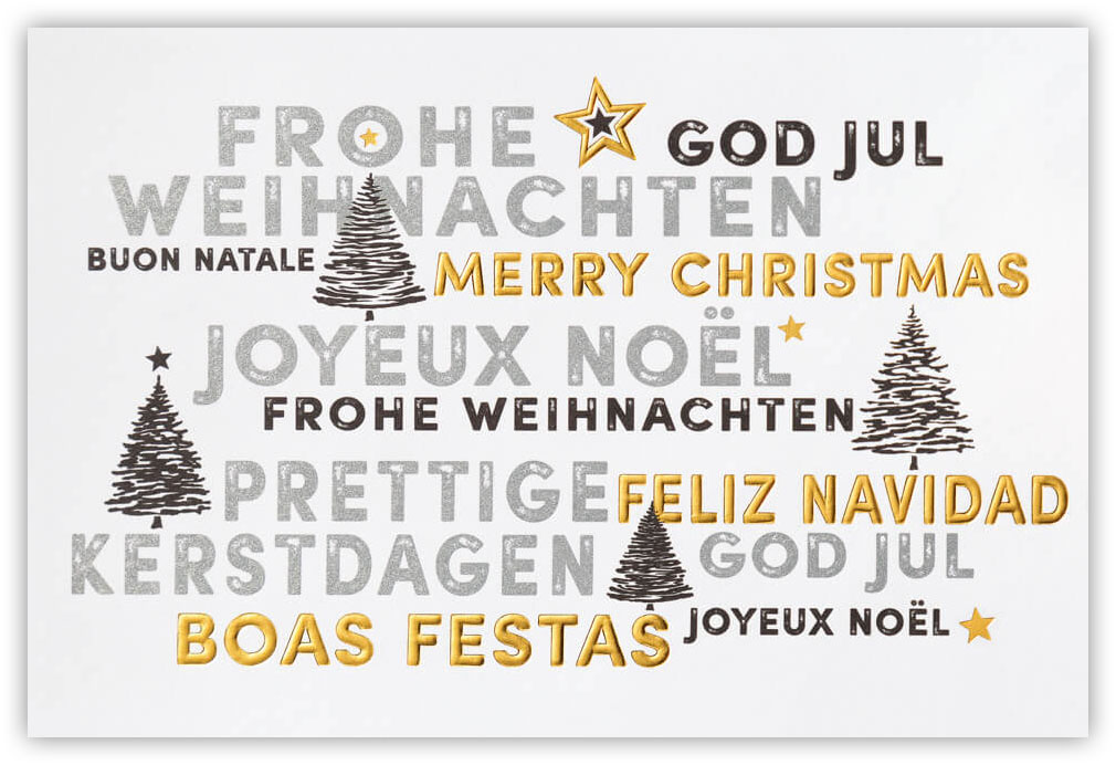 Weihnachtskarte weiß mit internationalen Weihnachtsgrüßen und Weihnachtsbäumen