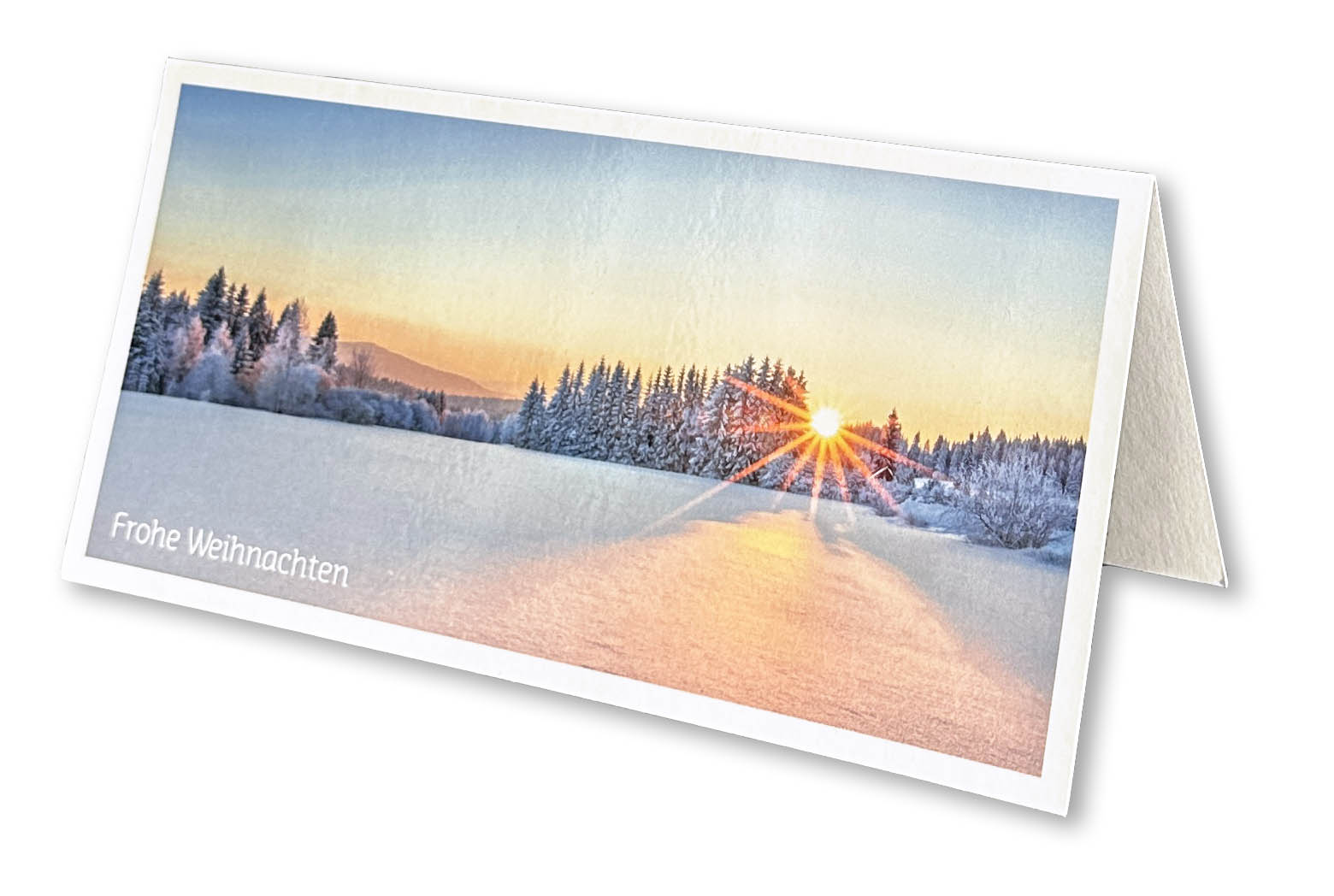 Alpine Weihnachtskarte im Panoramaformat, mit Winterlandschaft "untergehende Sonne im Wald"