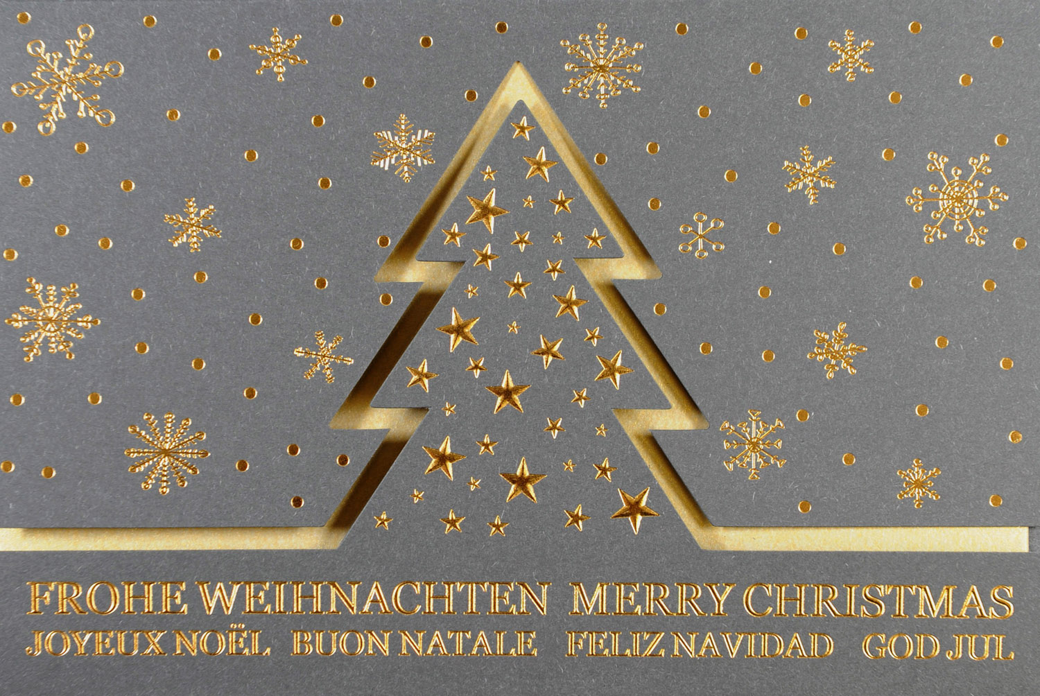 Weihnachtskarte anthrazit gold mit Sternen und gestanztem Weihnachtsbaum
