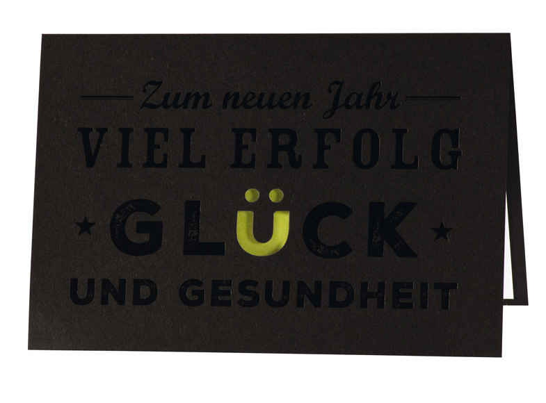 Neujahrskarte schwarz mit gestanztem Ü und grünem Einleger